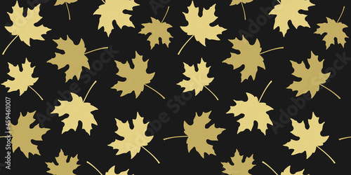 Golden beige silhouettes of maple leaves on black background. Endless texture with autumn leaves. Vector seamless pattern for wallpaper, wrapping paper, packaging, wrapper, surface texture and print