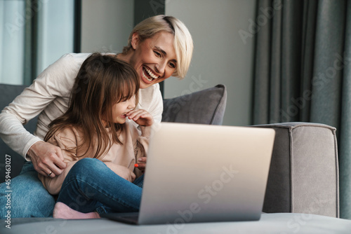 Happy young mother and her little daughter