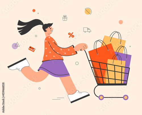 Happy woman enjoying shopping, she running with supermarket trolley and packages