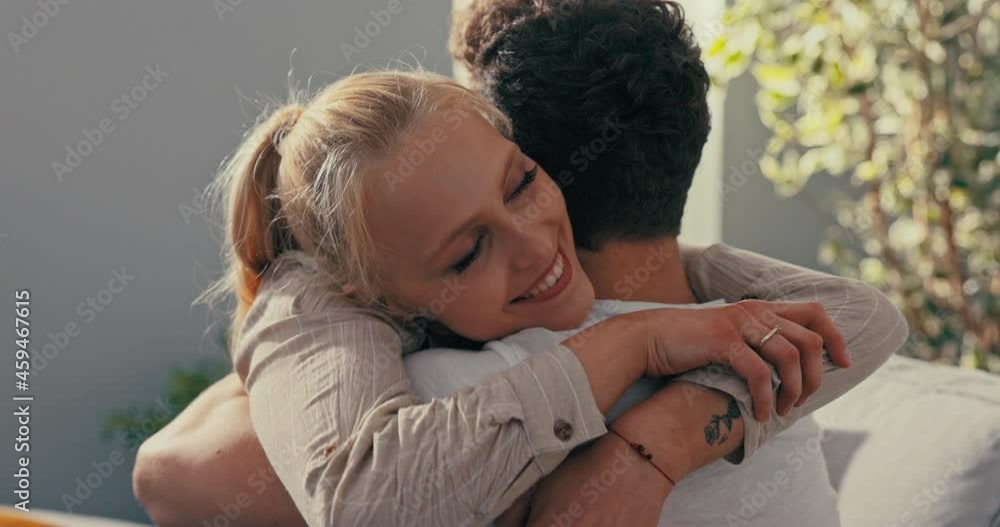 A pretty blonde sits on the couch next to her fianc , hugs him longingly, throws herself on his neck, embraces tightly, expresses pride, satisfaction, praises boyfriend, congratulates A pretty blonde sits on the couch next to her fianc , hugs him longingly, throws herself on his neck, embraces tightly, expresses pride, satisfaction, praises boyfriend, congratulates