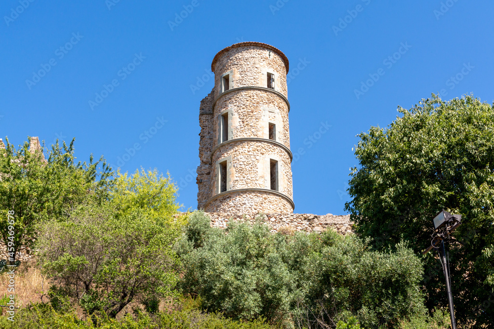 Walking on ancient french village Grimaud, touristic destination with ruines fortress castle on top, Var, Provence, France