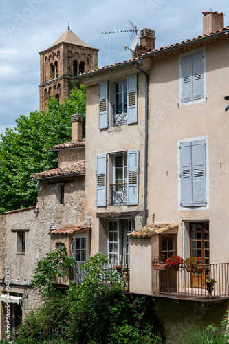 View on mountains cliff, old houses, green valley in remote medieval village Moustiers-Sainte-Marie in Provence, France