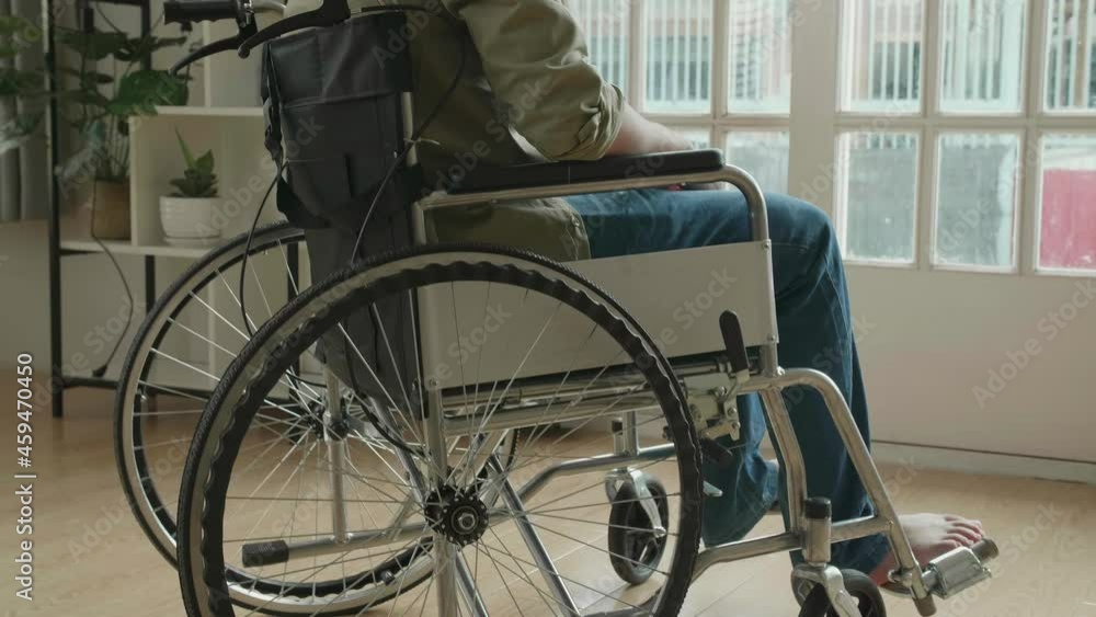 Disappointed Asian Man Sitting In A Wheelchair Near Door In The House
Disappointed Asian Man Sitting In A Wheelchair Near Door In The House