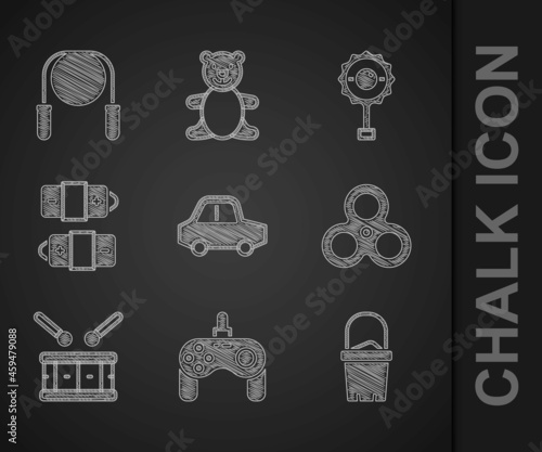 Set Toy car, Gamepad, Sand in bucket, Fidget spinner, Drum with drum sticks, Battery, Rattle baby toy and Jump rope icon. Vector