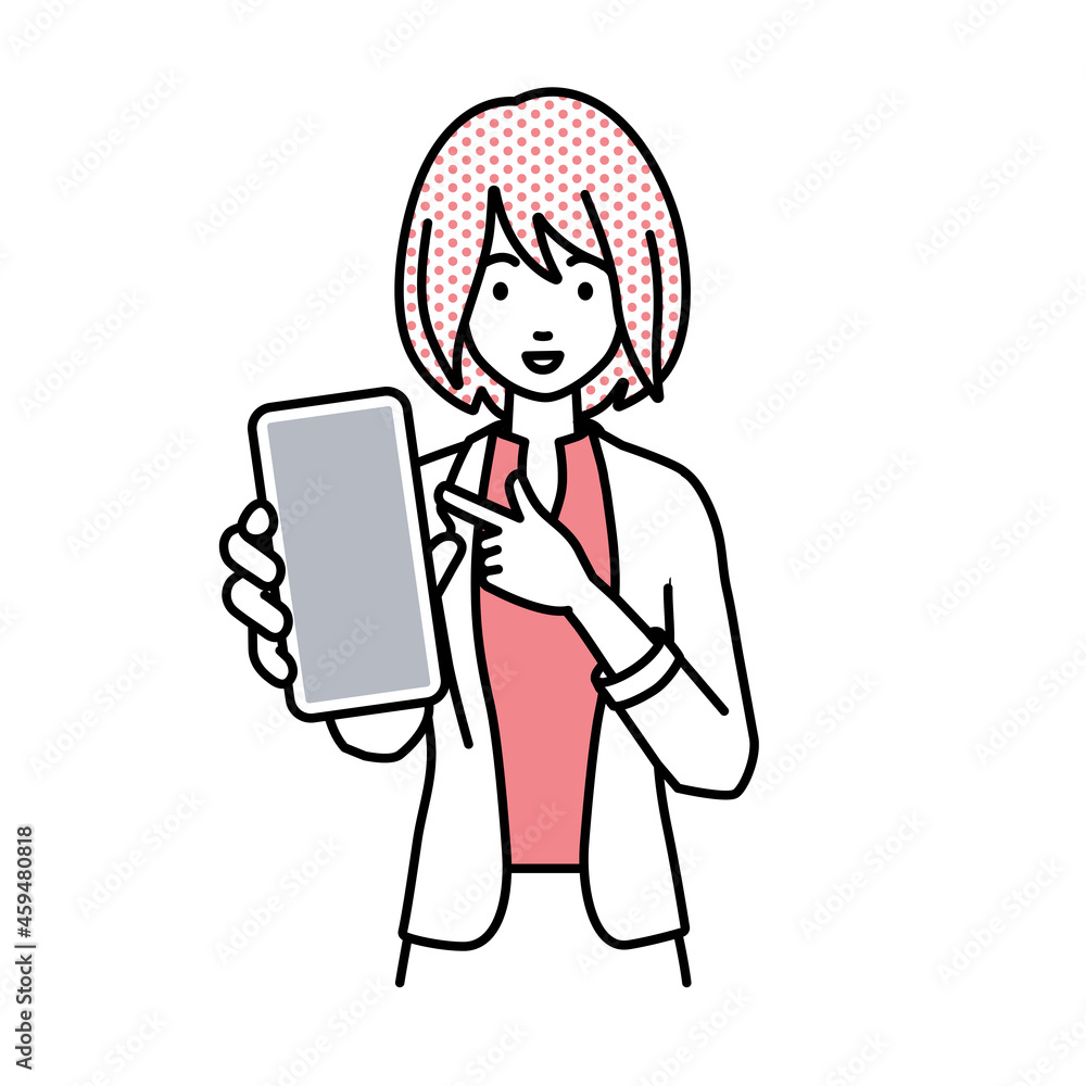 立ってスマートフォンを指差してこちらに向けて見せているジャケットの女性