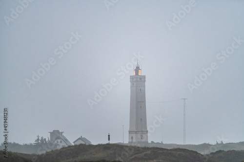 lighthouse on the coast, blavandshuk fyr photo