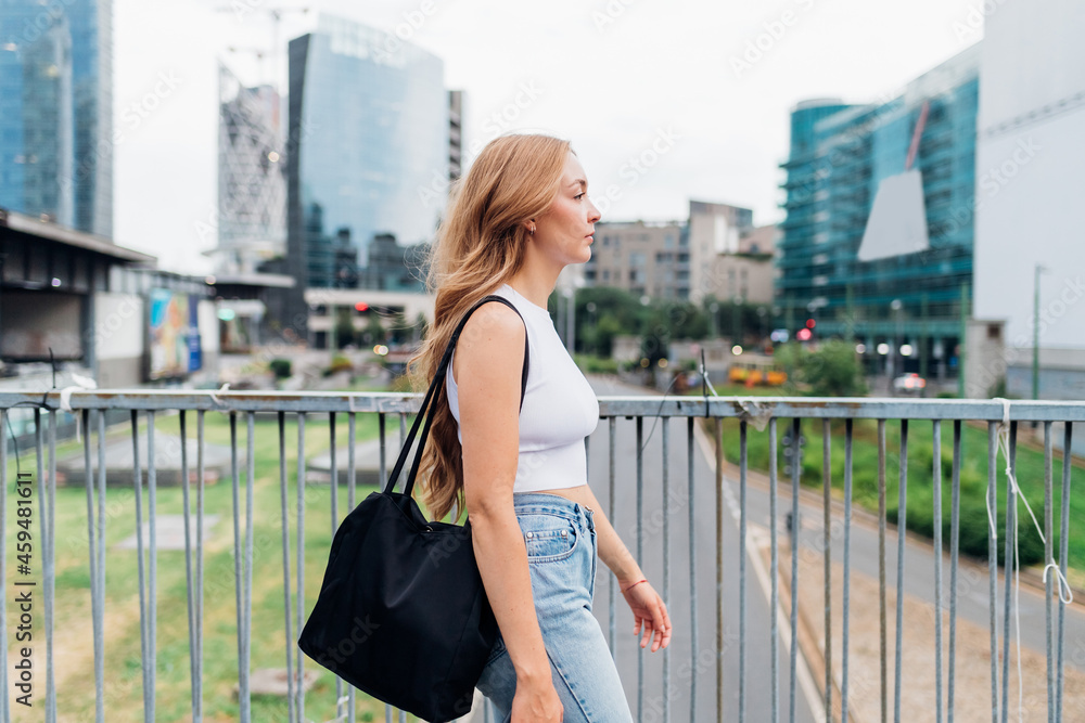 Young woman caucasian walking outdoor going to work Young woman caucasian walking outdoor going to work