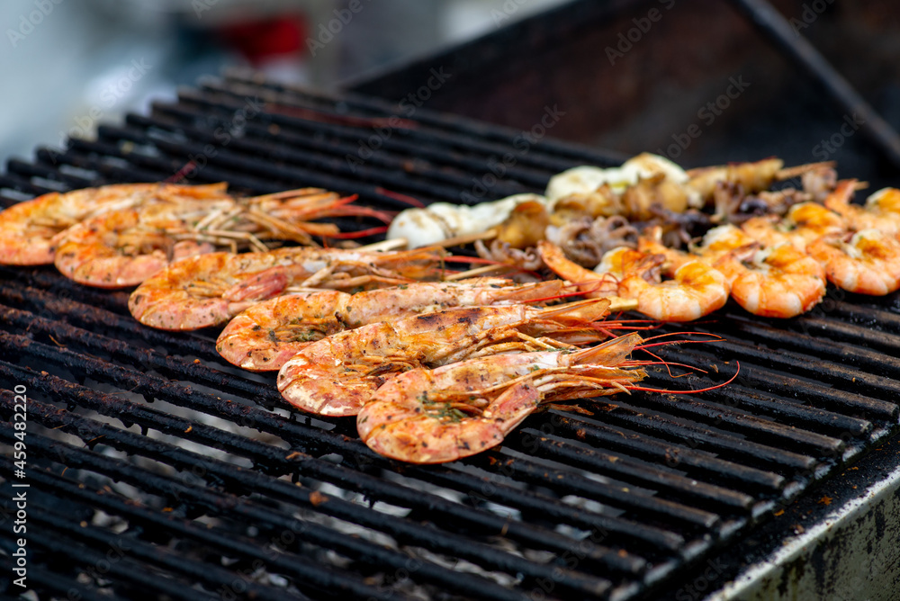 Grilled prawns, seafood and langoustines. BBQ with seafood Grilled prawns, seafood and langoustines. BBQ with seafood