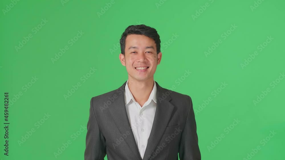 Young Asian Business Man Warmly Smiling On Green Screen Background In The Studio
Young Asian Business Man Warmly Smiling On Green Screen Background In The Studio