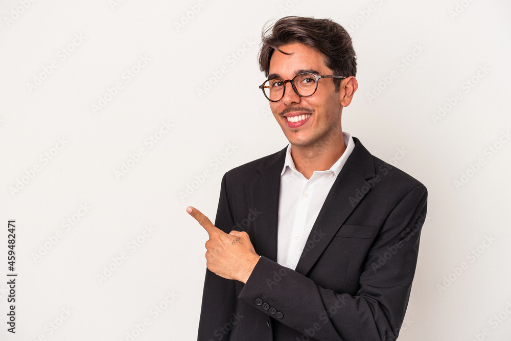 Young mixed race business man isolated on white background smiling and pointing aside, showing something at blank space. Young mixed race business man isolated on white background smiling and pointing aside, showing something at blank space.