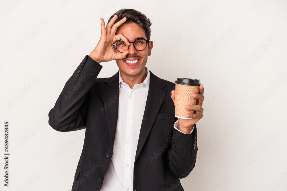 Young mixed race business man holding take away coffee isolated on white background excited keeping ok gesture on eye. Young mixed race business man holding take away coffee isolated on white background excited keeping ok gesture on eye.