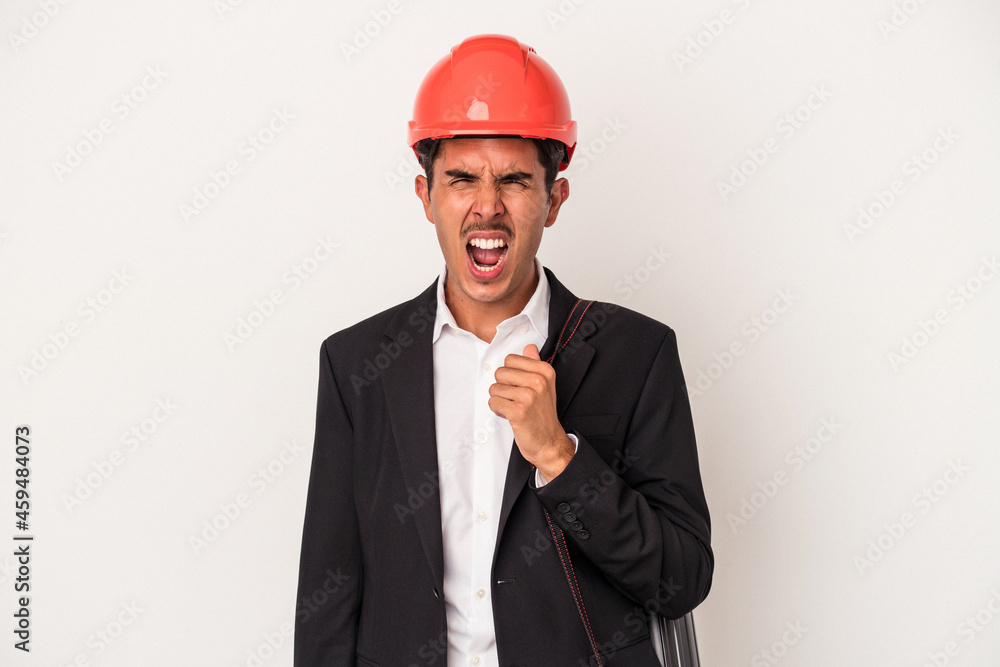 Young architect mixed race man isolated on white background screaming very angry and aggressive. Young architect mixed race man isolated on white background screaming very angry and aggressive.