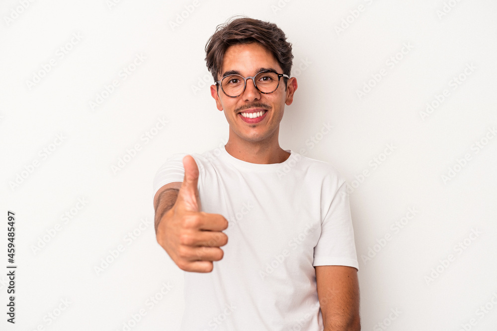 Young mixed race man isolated on white background smiling and raising thumb up Young mixed race man isolated on white background smiling and raising thumb up