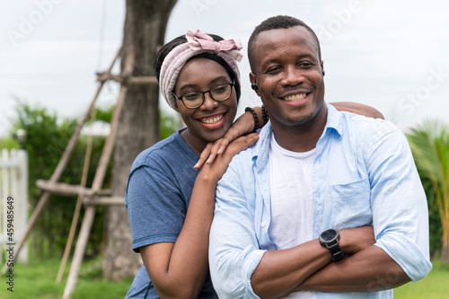 Happy and smiling young African American couple in outdoor garden - sweet and funny lover couple, Family outdoor lifestyle © lukyeee_nuttawut