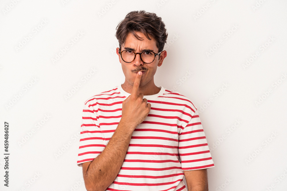 Young mixed race man isolated on white background thinking and looking up, being reflective, contemplating, having a fantasy.