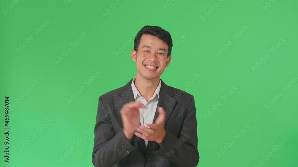 Young Asian Business Man Clapping Her Hands In The Green Screen Studio
Young Asian Business Man Clapping Her Hands In The Green Screen Studio