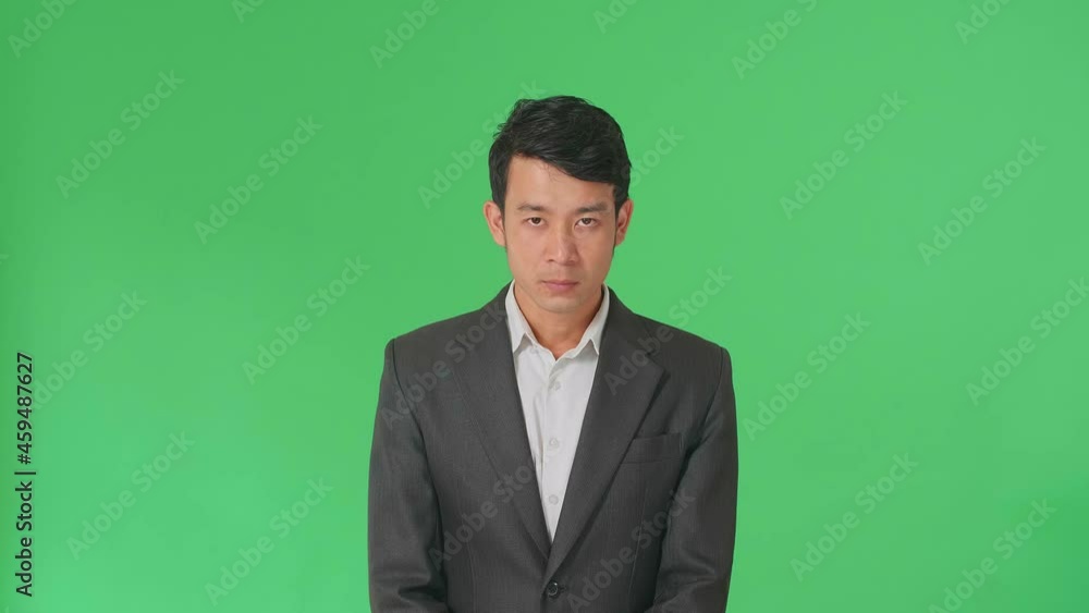 Terrible Asian Business Man Looking At Camera In The Green Screen Studio
Terrible Asian Business Man Looking At Camera In The Green Screen Studio