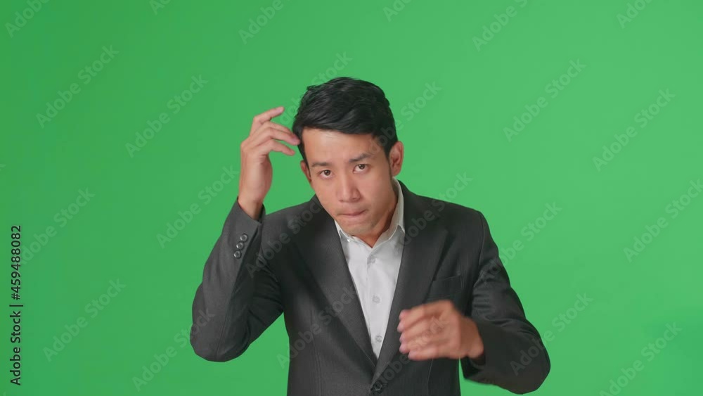 Asian Business Man Touching His Hair While Looking At Camera Like A Mirror On Green Screen In Studio
Asian Business Man Touching His Hair While Looking At Camera Like A Mirror On Green Screen In Studio