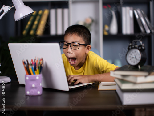 School boy watching online accidentally watching inappropriate content while surfing the internet.