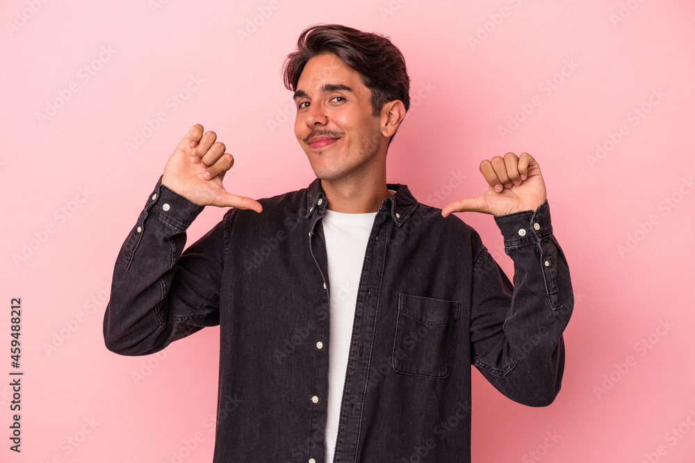 Young mixed race man isolated on white background feels proud and self confident, example to follow. Young mixed race man isolated on white background feels proud and self confident, example to follow.