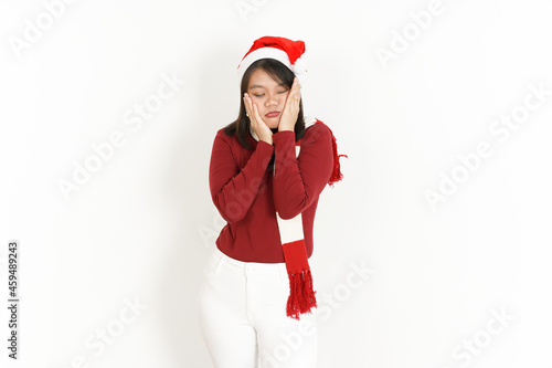 Beautiful Asian Woman Wearing Red Turtleneck and Santa Hat Isolated On White Background