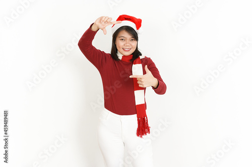 Making Frame With Hand of Beautiful Asian Woman Wearing Red Turtleneck and Santa Hat Isolated On White Background