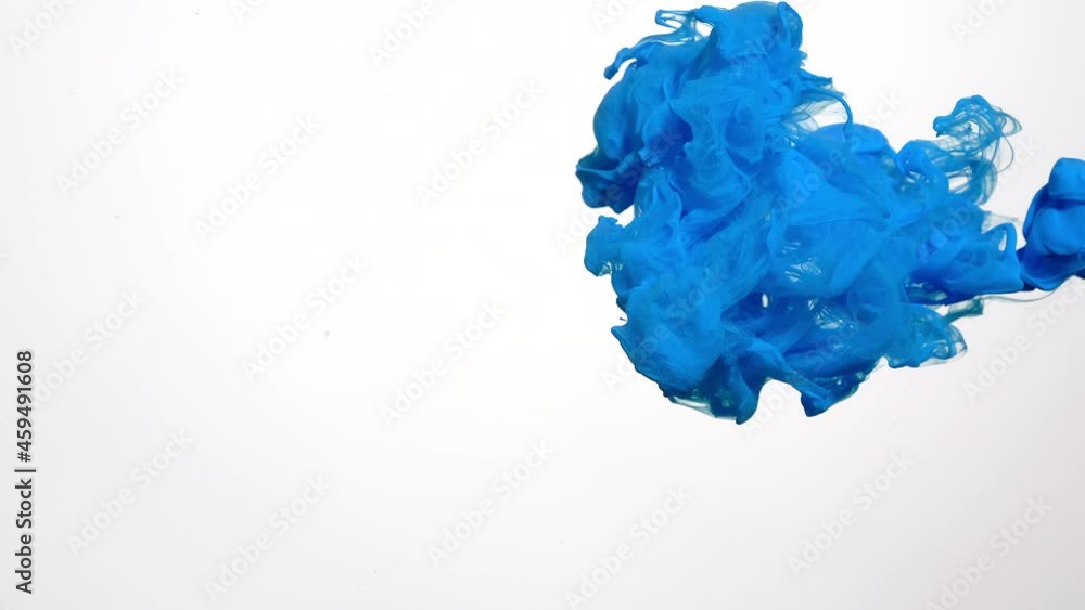 Chic cyan blue watercolor ink in water isolated on white background. Hypnotic abstract background. Screensaver, relaxing meditative background. Slow motion of colored watercolors in water. Chic cyan blue watercolor ink in water isolated on white background. Hypnotic abstract background. Screensaver, relaxing meditative background. Slow motion of colored watercolors in water.