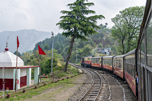 Narrow gauge Shivalik Deluxe express train on curve while departing Shoghi. photo
