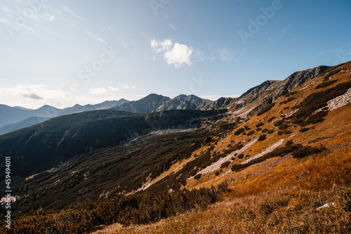 Hiking to salatin and brestova peak from zuberec. Western Tatras mountains, Rohace Slovakia. Hiker with backpack rises to the mountains. Slovakia mountains landscape. photo