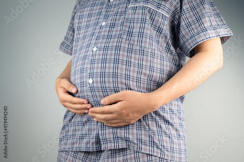 pregnant woman holding her stomach