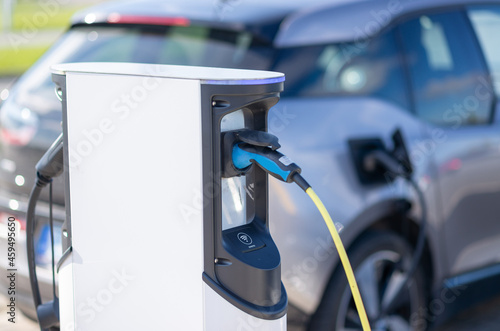 Electric car charging at a station