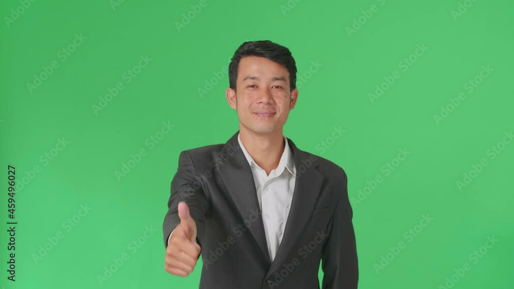 Happy Asian Business Man Showing Thumbs Up And Thumb Down Gesture While Standing In The Green Screen Studio
Happy Asian Business Man Showing Thumbs Up And Thumb Down Gesture While Standing In The Green Screen Studio