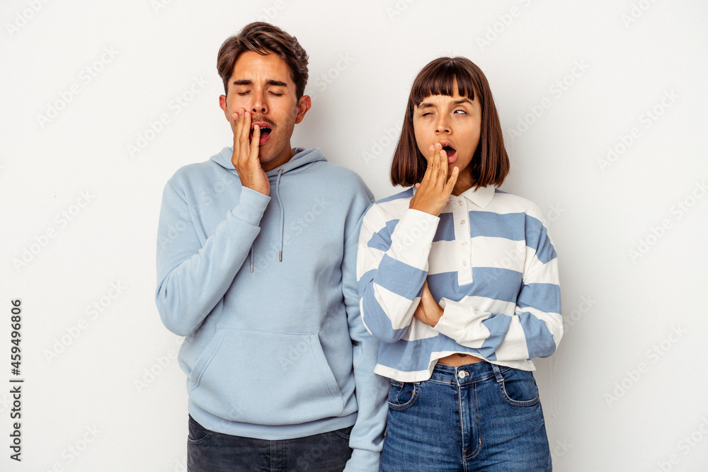 Young mixed race couple isolated on white background yawning showing a tired gesture covering mouth with hand. Young mixed race couple isolated on white background yawning showing a tired gesture covering mouth with hand.