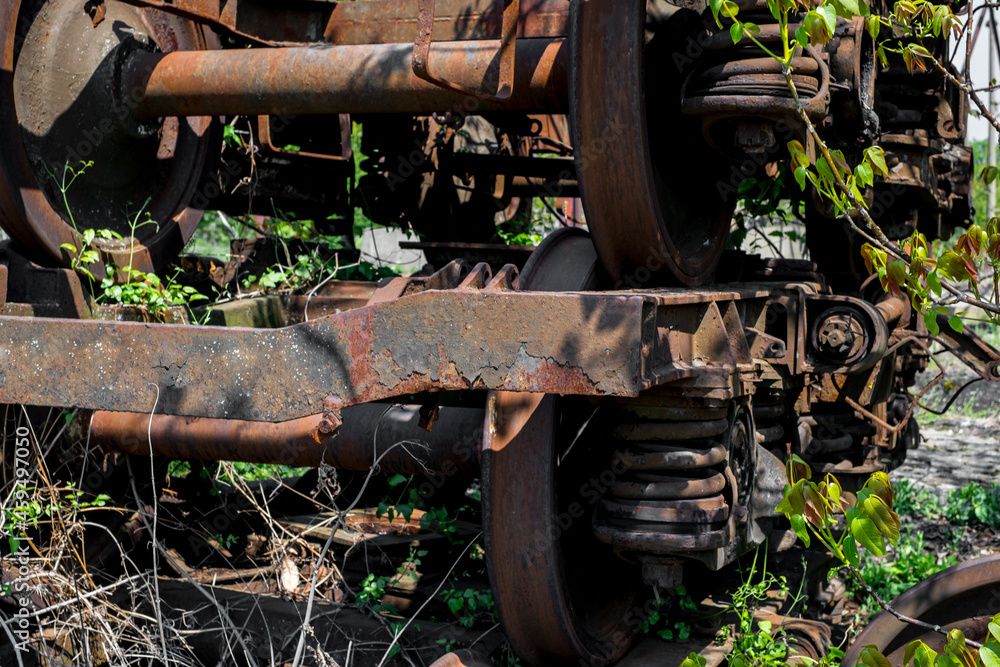 Rusty and abandoned train wheels with Railroad in the countryside