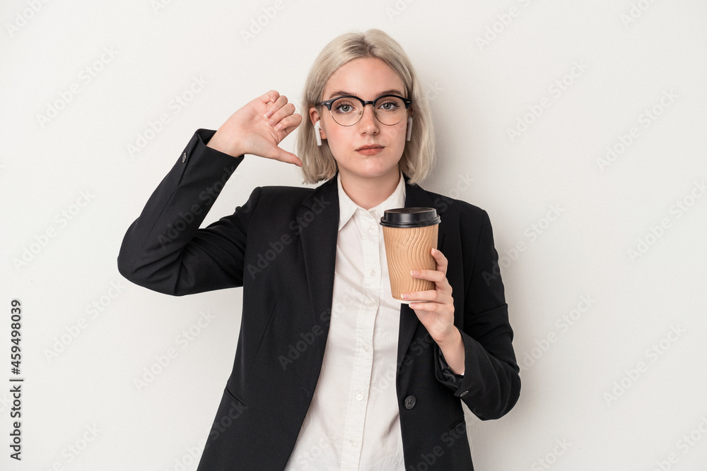 Young caucasian business woman holding take away coffee isolated on white background showing a dislike gesture, thumbs down. Disagreement concept. Young caucasian business woman holding take away coffee isolated on white background showing a dislike gesture, thumbs down. Disagreement concept.