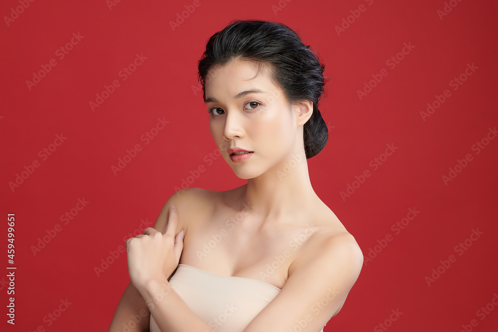 Beautiful young asian woman with clean fresh skin on red background, Face care, Facial treatment, Cosmetology, beauty and spa, Asian women portrait. Beautiful young asian woman with clean fresh skin on red background, Face care, Facial treatment, Cosmetology, beauty and spa, Asian women portrait.