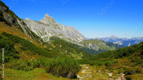 Gipfel der Zimba im Vorarlberg mit weitem Blick ins Montafon mit grünen Tälern unter blauem Himmel photo