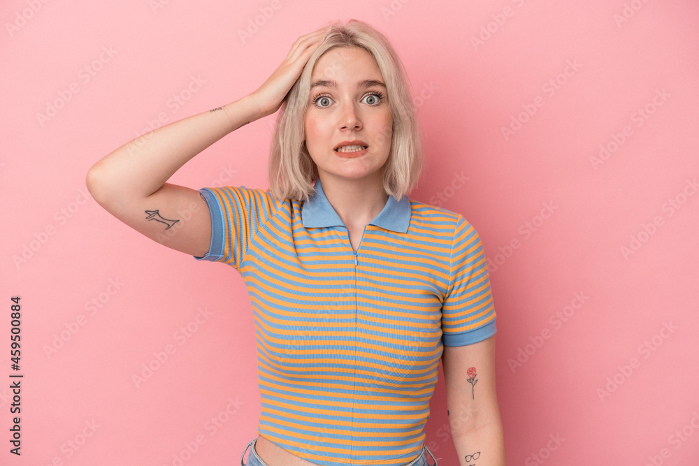 Young caucasian woman isolated on pink background being shocked, she has remembered important meeting. Young caucasian woman isolated on pink background being shocked, she has remembered important meeting.
