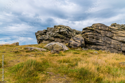 A view of the southern side of the summit of the Almscliffe crag in Yorkshire, UK in summertime photo