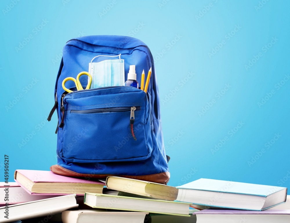 Stylish backpack and different school stationery on desk. Back to school Stylish backpack and different school stationery on desk. Back to school