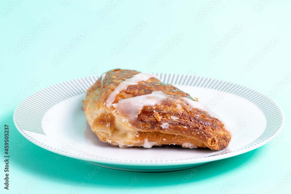 Sweet bakery on a plate on green background