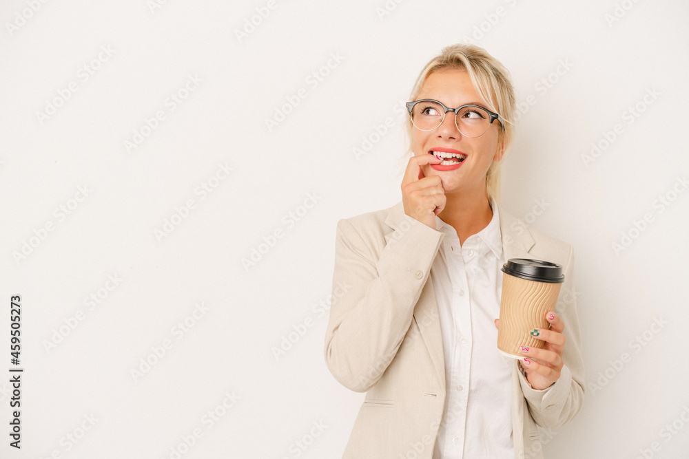 Young business Russian woman holding take away coffee isolated on white background relaxed thinking about something looking at a copy space. Young business Russian woman holding take away coffee isolated on white background relaxed thinking about something looking at a copy space.