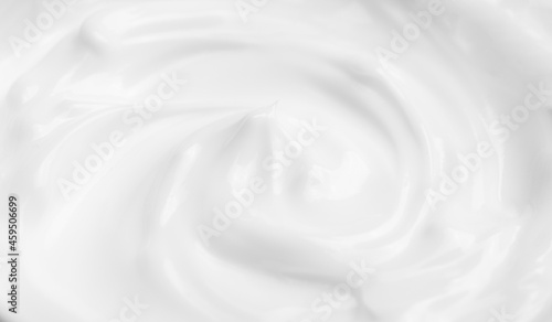 Cosmetic cream texture background. White surface cosmetic cream for skin and body in an open jar
