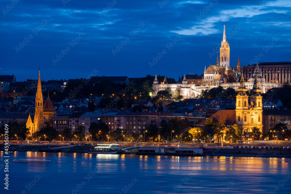 view on Fisherman Bastion and Matthias church at Danube river during dusk in Budapest, Hungary view on Fisherman Bastion and Matthias church at Danube river during dusk in Budapest, Hungary