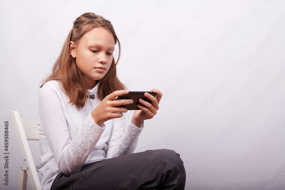 a girl with a smartphone on a blue background a girl with a smartphone on a blue background