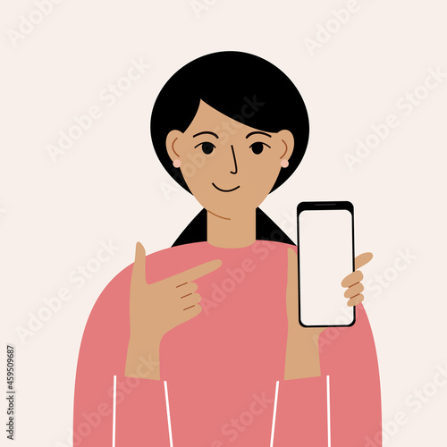 Joyful woman with mobile phone, front view. Points her finger at the phone screen. Smartphone and internet addiction.