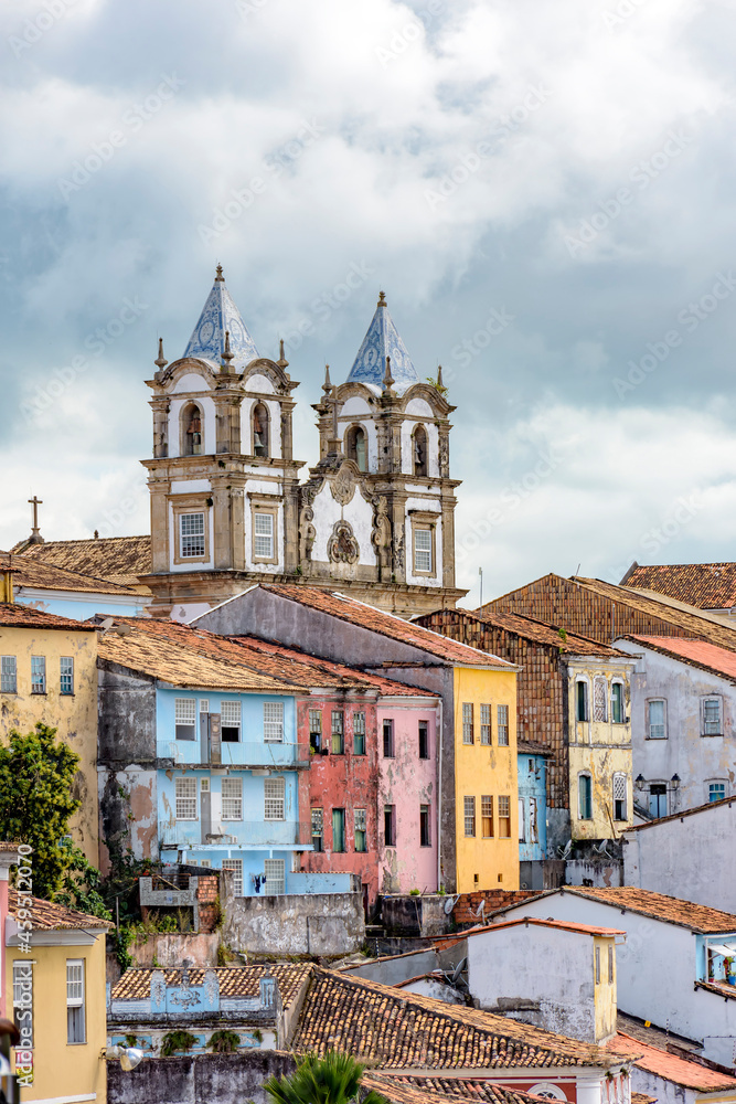 Colorful old and historic district of Pelourinho with cathedral tower on the background. The historic center of Salvador, Bahia, Brazil.