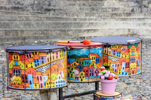 Ethnic and colorful decorated set of drums hand made painted on the streets of Pelourinho, Salvador, Bahia © Fred Pinheiro