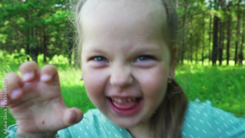 Little girl grimaces in front of the camera. Baby emotion concept Little girl grimaces in front of the camera. Baby emotion concept