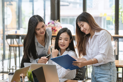 Happy of working together in a team of businesswoman analyzes brainstorming using graph at the office.